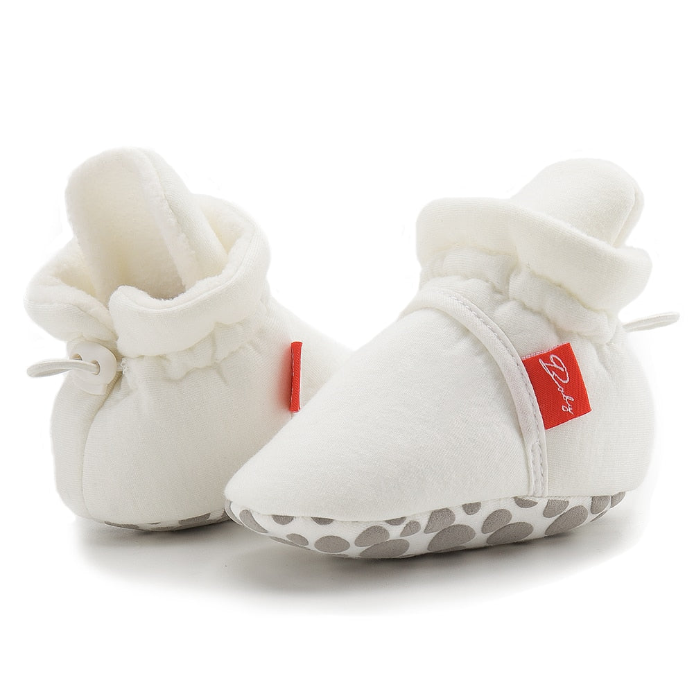 chausson souple pour bébé de couleur blanche